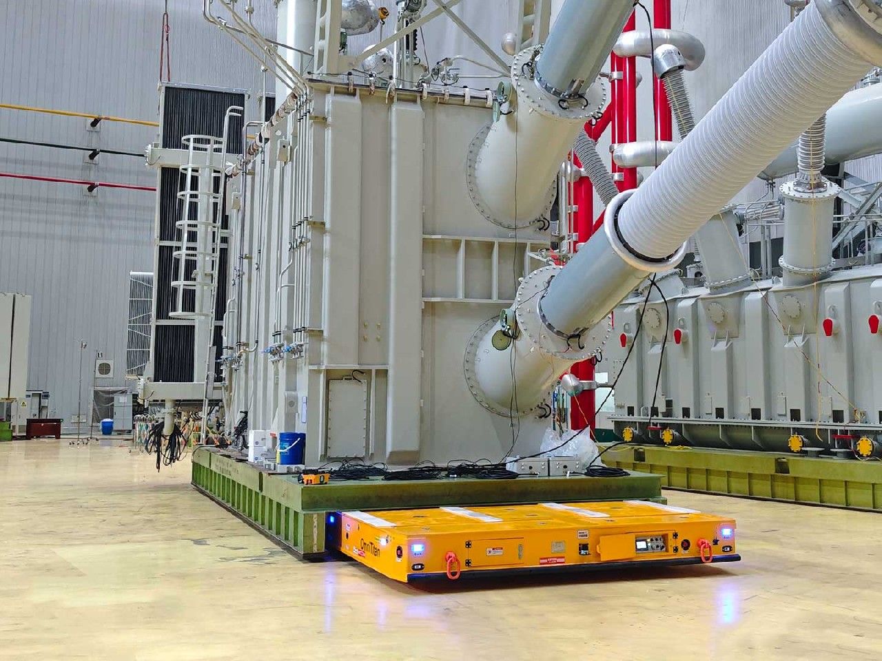 Heavy Duty AGV on a plant floor demonstrating trackless heavy load transfer
